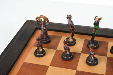 At Auction: A large ornate chess set with sterling silver board. Board  measures 46x46x8cm