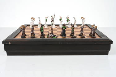 At Auction: A large ornate chess set with sterling silver board. Board  measures 46x46x8cm