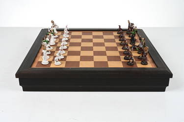 At Auction: A large ornate chess set with sterling silver board. Board  measures 46x46x8cm