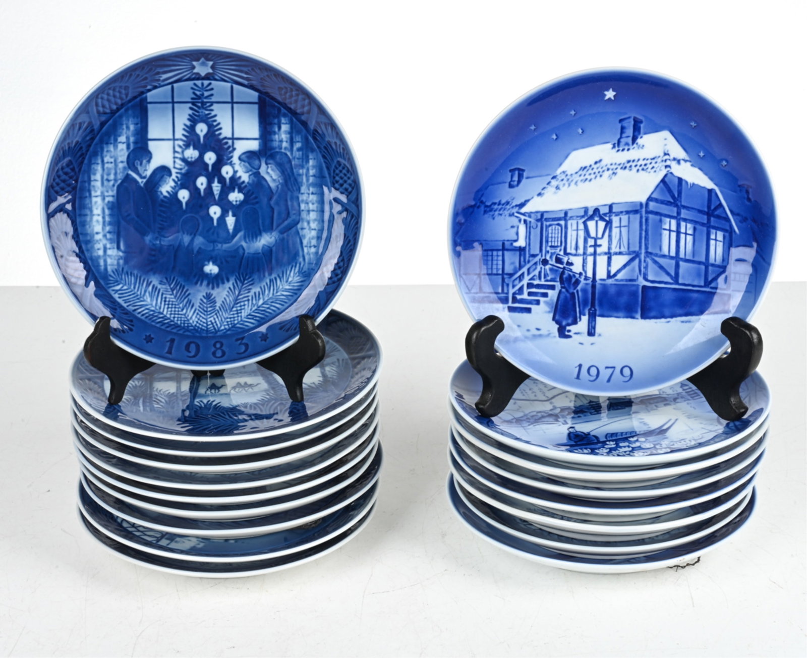 DANISH BLUE & WHITE PORCELAIN COLLECTOR'S PLATES: Includes (11) Royal Copenhagen plates and (7) Desiree Svend Jensen plates. Dimensions: (Larger, Desiree) Dia. 7.5" Condition: No issues to note; no signs of chips, cracks, or repairs.