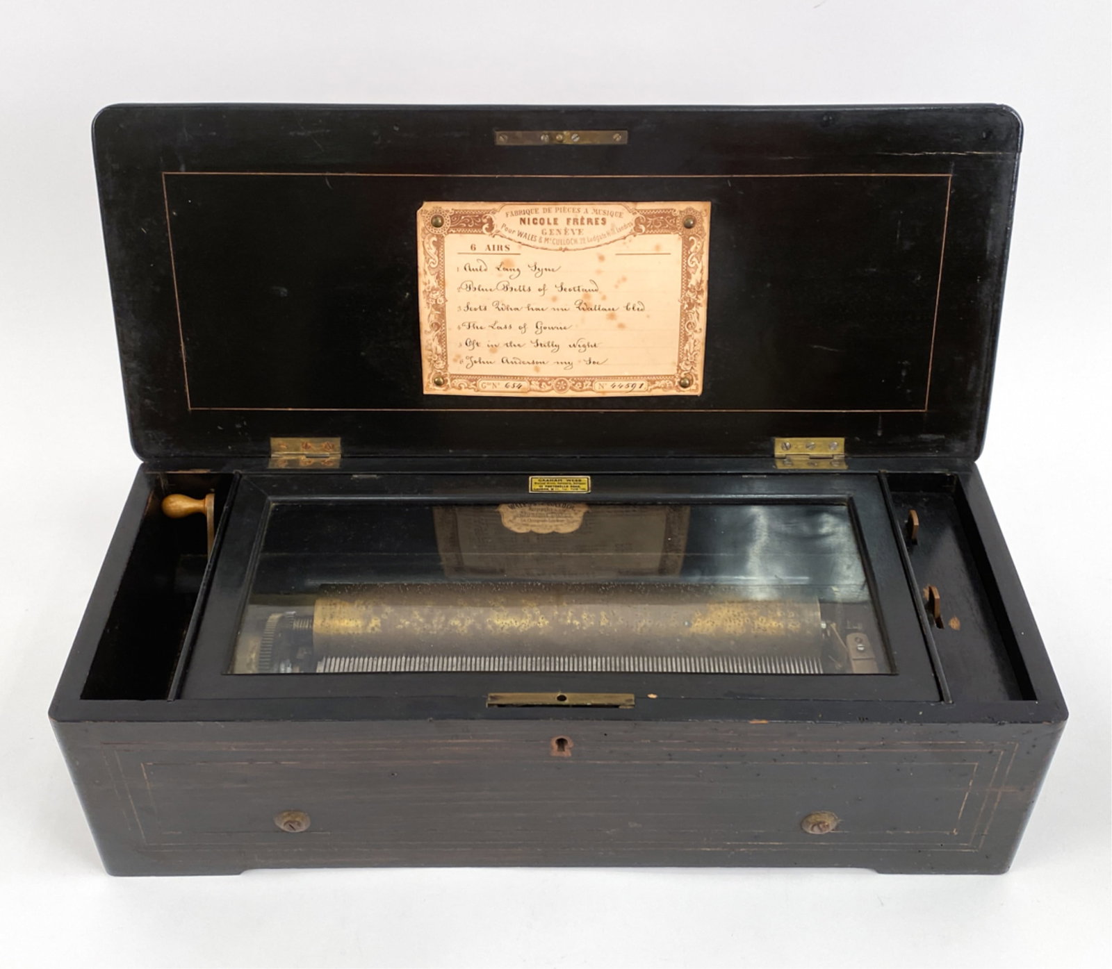 ANTIQUE NICOLE FRERES MUSIC BOX: With Nicole Freres label. Dimensions: H 5.5" x W 19.5" x D 8" Condition: Showing signs of age and use including handling marks. Untested.