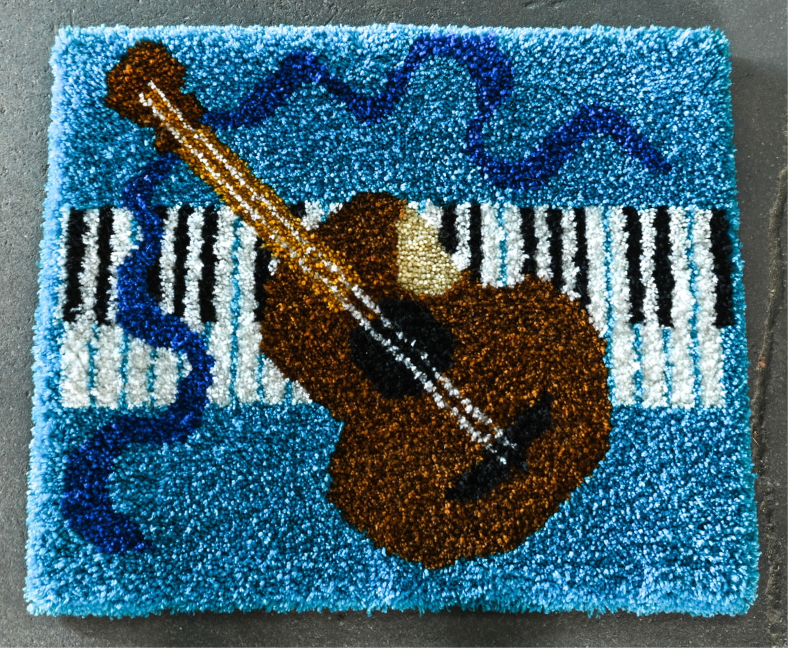 MID-CENTURY RYA TAPESTRY; GUITAR & PIANO: Dimensions: H 28" x W 33.5" Condition: Light surface dust; overall very few signs of wear.