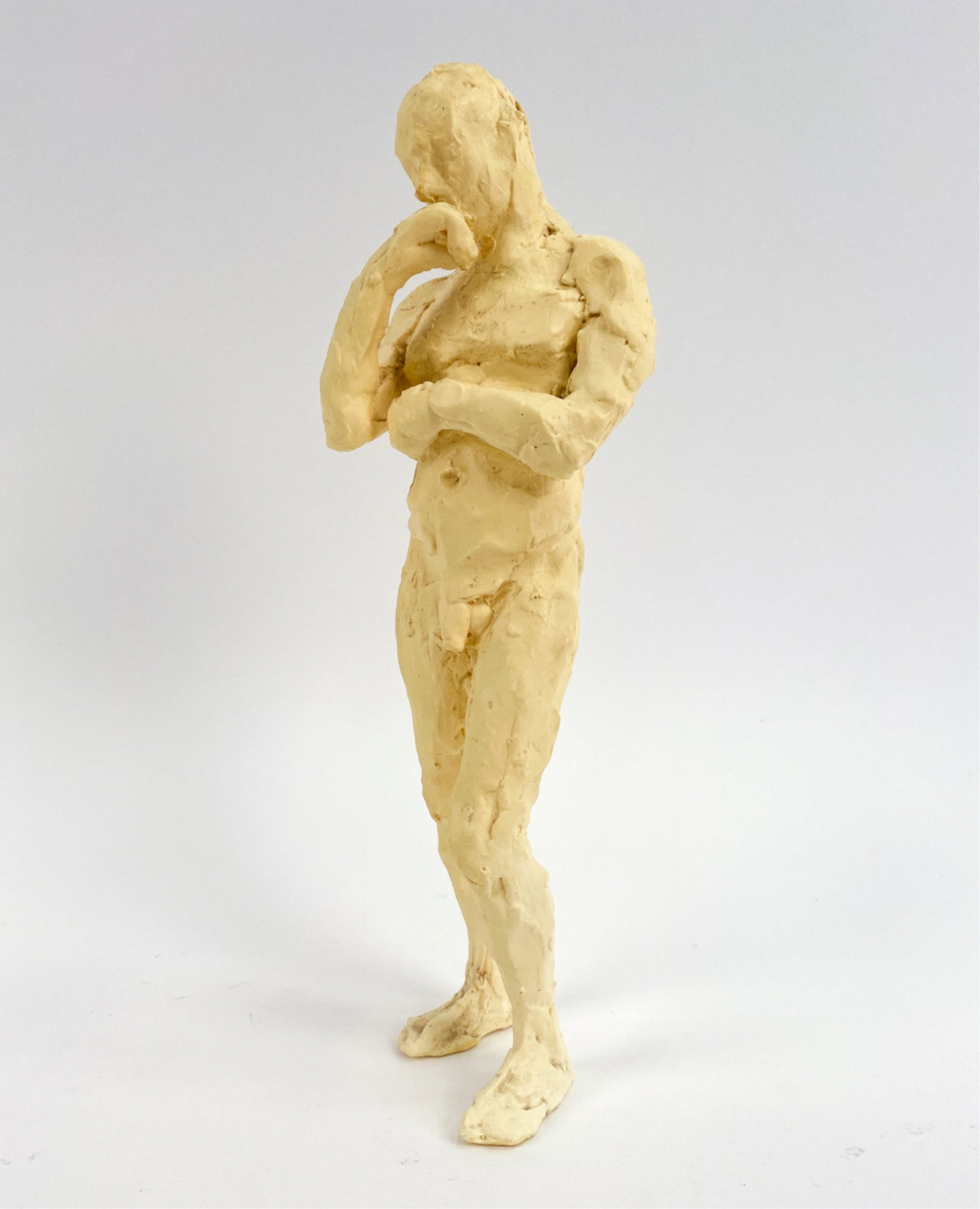 MODERN RESIN CAST SCULPTURE: Cast sculpture, probably from a clay or wax model, of a standing male nude. Apparently unsigned. Dimensions: H 11.5" x W 3.5" x D 3" Condition: No issues to note.