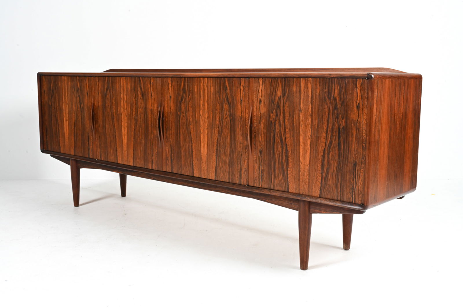 ALF AARSETH GUSTAV BAHUS "JAN" ROSEWOOD SIDEBOARD: Rare Model "Jan" credenza in luxurious rosewood, designed by Alf Aarseth for Gustav Bahus Norway, c. 1960's, Dimensions: H 32.5" x W 88" x D 17.5" Condition: Missing shelves. In very good vintage cond