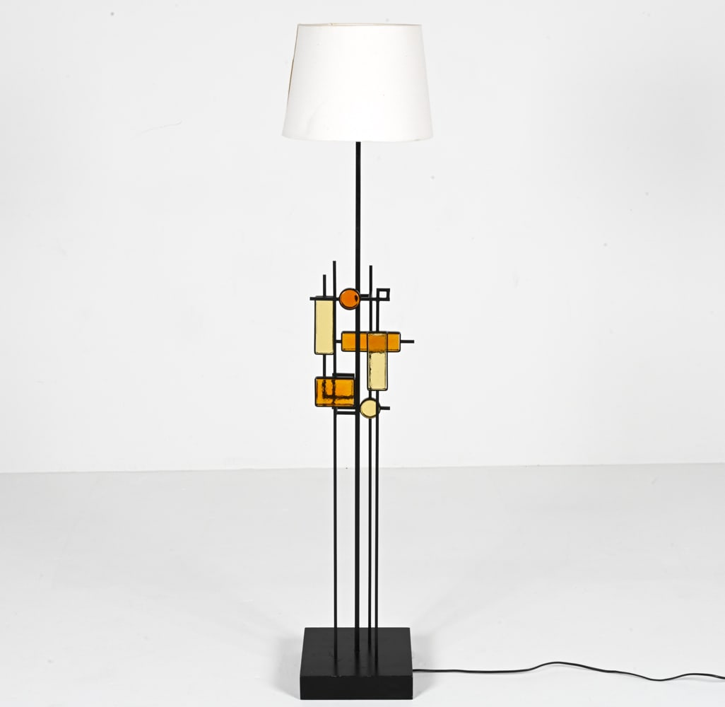 SVEND AAGE HOLM SORENSEN IRON & STAINED GLASS LAMP: Swedish Architectural floor lamp in wrought iron and shades of amber glass, on wood base. With original Holm Sorensen label underneath, c. 1960's. Dimensions: (Without shade) H 49.5" x W 9.5" x D 9.5"