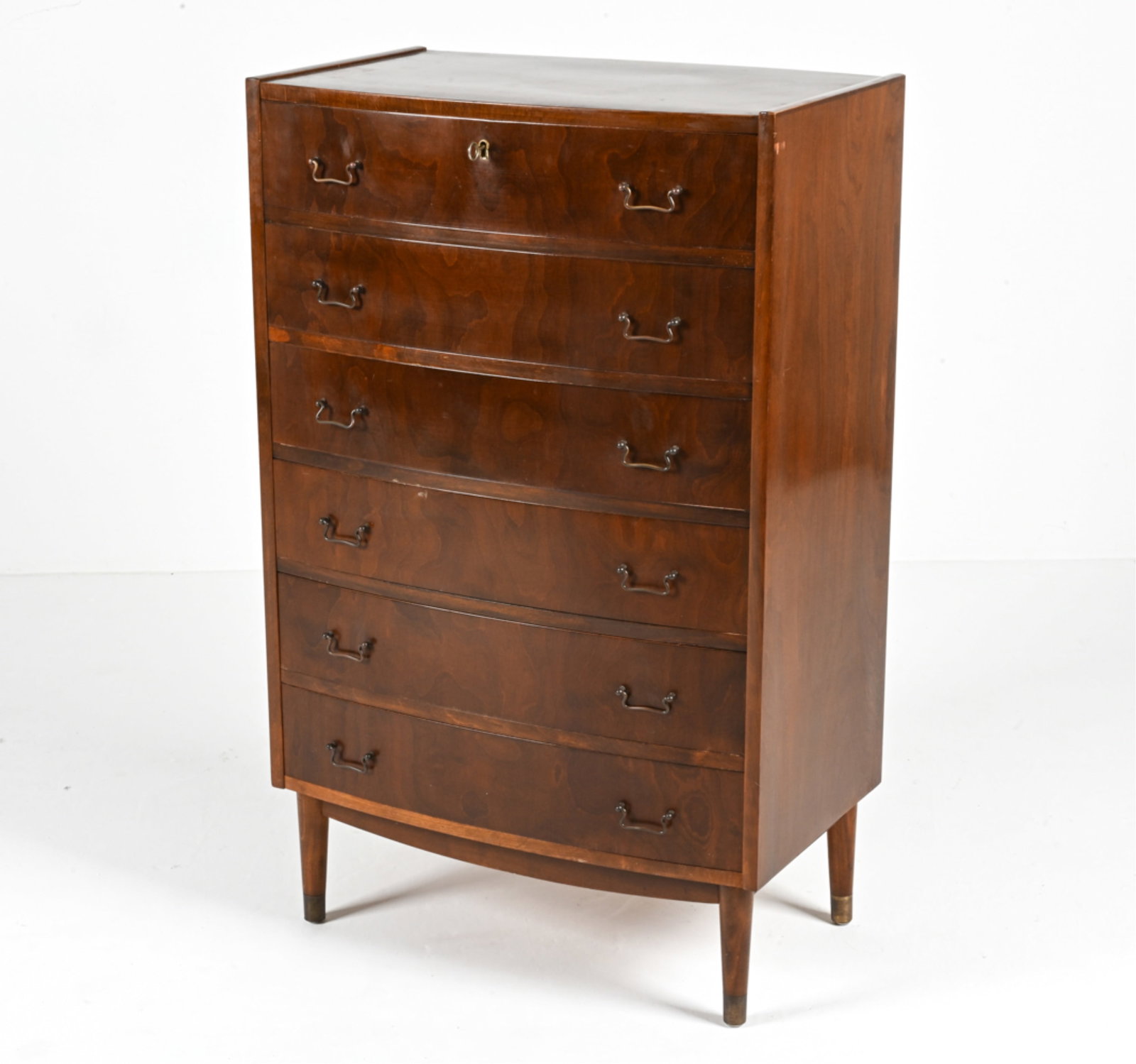 DANISH CABINETMAKER NUTWOOD BOW-FRONT CHEST: Key included. Beautiful tallboy chest in richly figured nut wood, with dovetailed drawers. Apparently unsigned, c. 1960's. Dimensions: H 44.25" x W 27.75" x D 18" Condition: Wear consistent with age a