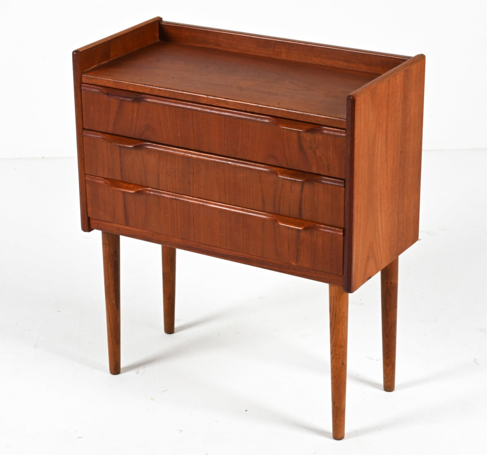 DANISH TEAK THREE-DRAWER CHEST, 1960'S: Dimensions: H 27.5" x W 23.75" x D 11.5" Condition: A few water spots; scattered dings and scuffs. Overall light wear consisent with age and use. G203