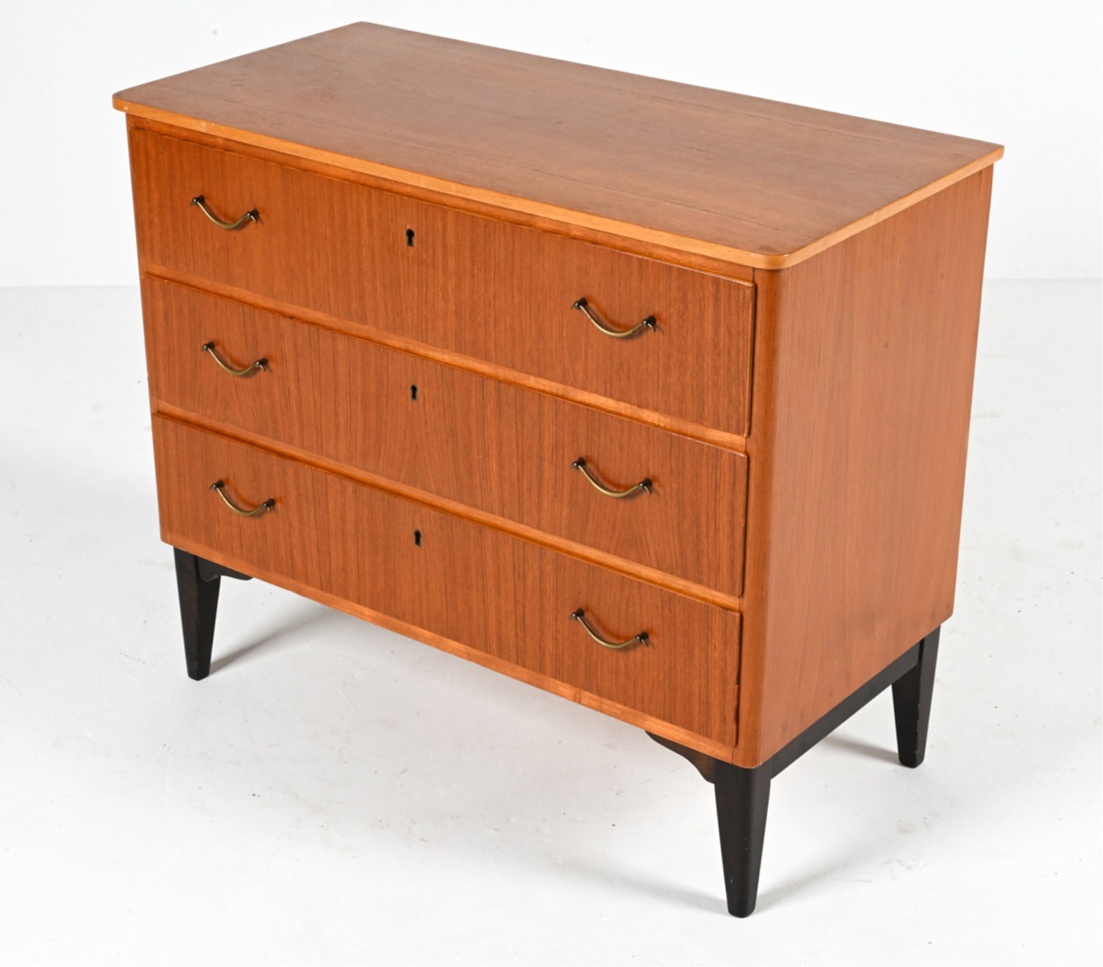 SCANDINAVIAN MID-CENTURY TEAK CHEST OF DRAWERS: Likely Swedish; c. 1950's-1960's. Key included. Top drawer with original divider. Dimensions: H 27.5" x W 32.5" x D 15.75" Condition: In good vintage condition overall. A few faint water spots, minor 