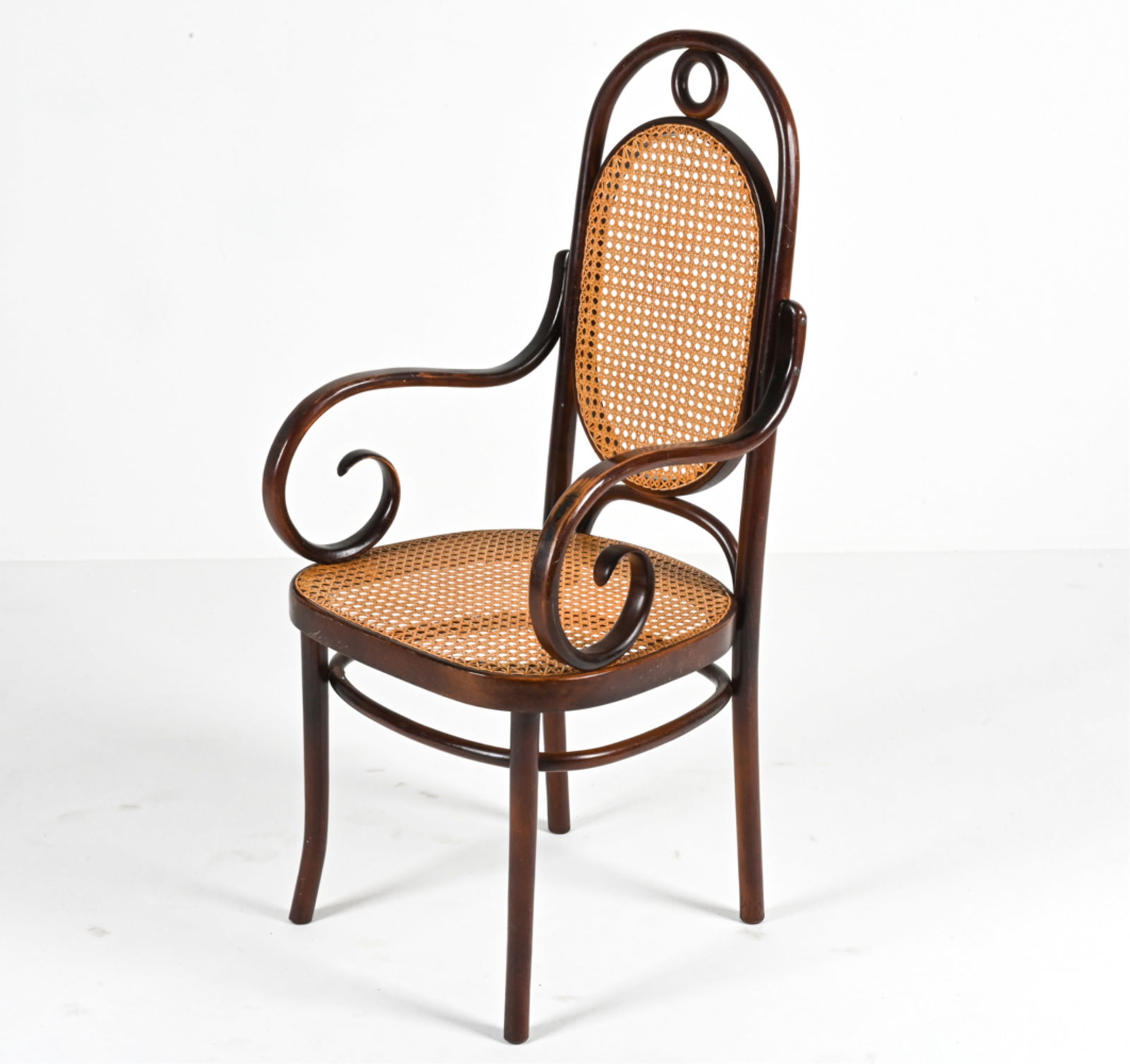THONET & HOFFMANN FOR FMG MODEL 17 ARMCHAIR: Iconic Model 17 "Long John" armchair in bent beech wood and cane. Originally designed by Michael Thonet around 1865; this example was produced by FMG of Poland - a factory established by Josef Hoffman