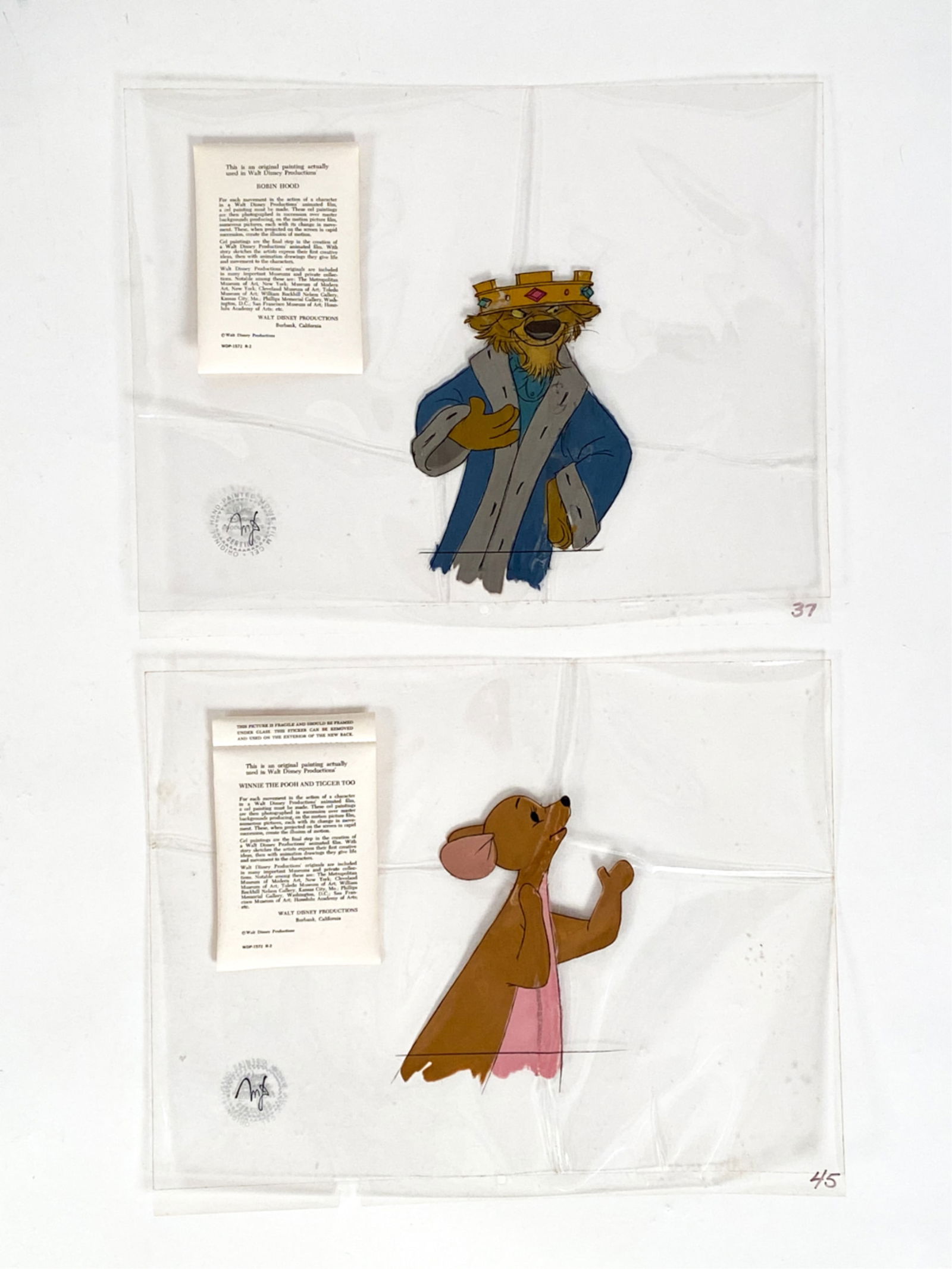 (2) ORIGINAL WALT DISNEY MOVIE CELS: Including Piglet from Winnie the Pooh and Tigger Too, with Disney label; and King John from Robinhood, with Disney label. Both in original folders, both unframed. Dimensions: (Folder) H 13" x W 16.5"