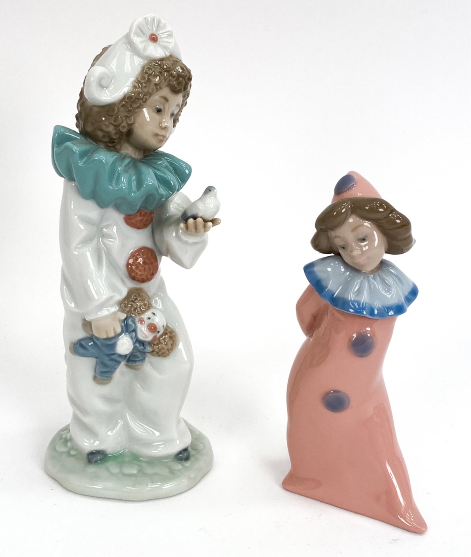 (2) LLADRO PORCELAIN FIGURES: Marked underneath. Dimensions: (Taller) H 8" Condition: No issues to note.