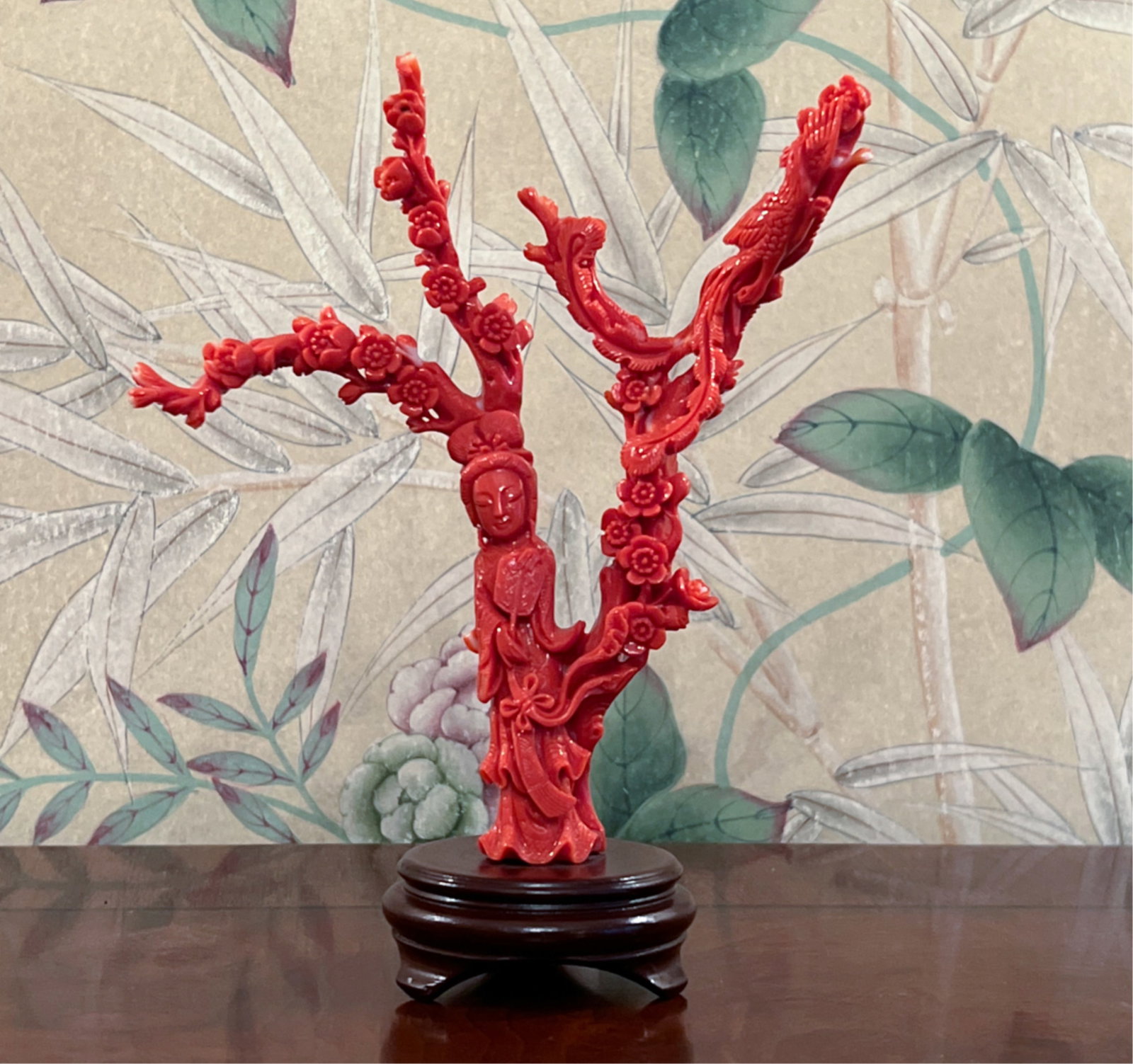 EARLY 20TH C. CHINESE CORAL CARVING: Immortal figure under prunus blossoms, upon which a phoenix rests. Originally purchased for $800.00. Dimensions: H 7" x W 5.5" x D 2" Condition: A couple of rough edges.