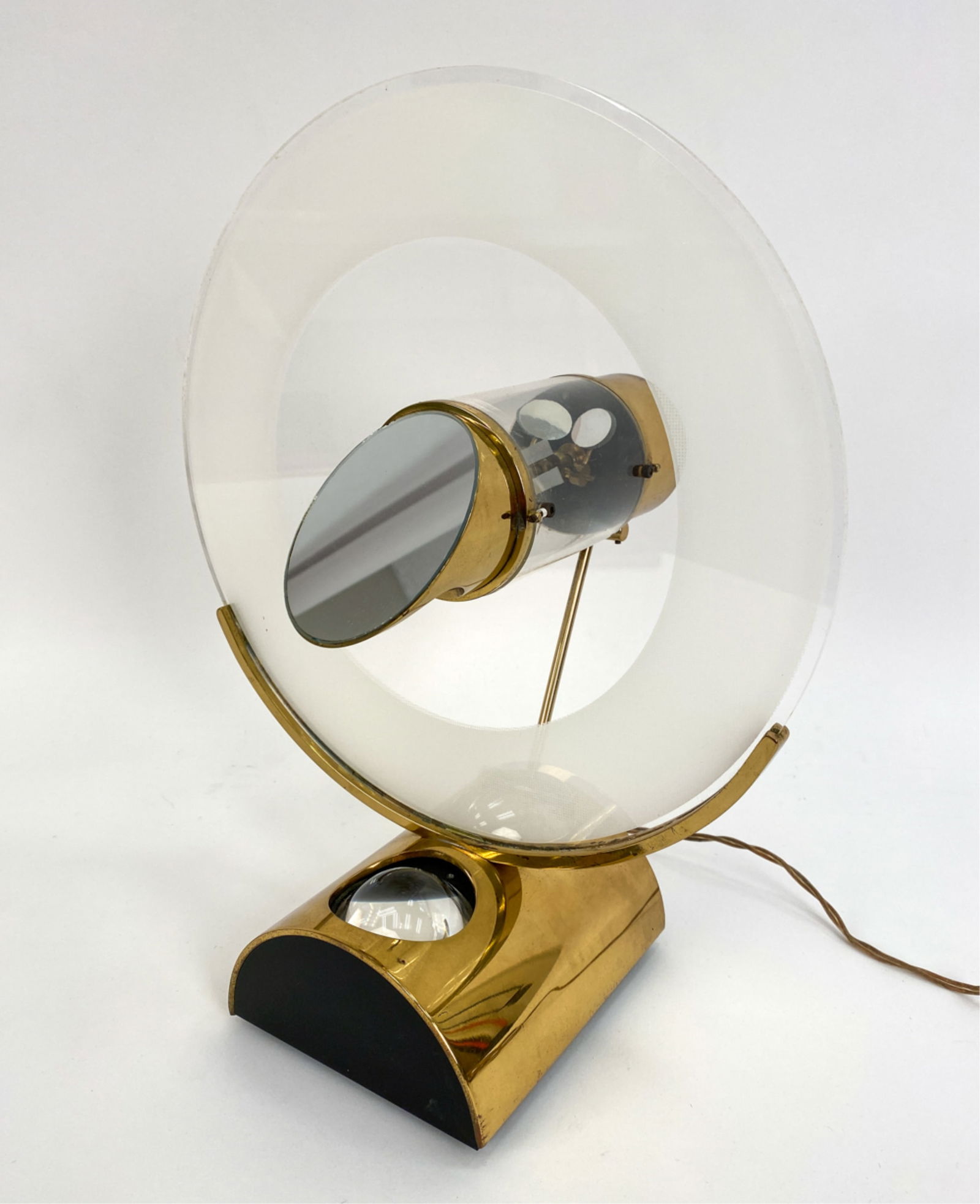 JEROME SIMON LIGHT-BEAM PROJECTION CLOCK: "Design in Time and Light" light-beam projection clock was created and patented in 1981 by Jerome Simon. The arched brass and glass base magnifies a single beam of light, periscoping it through the un