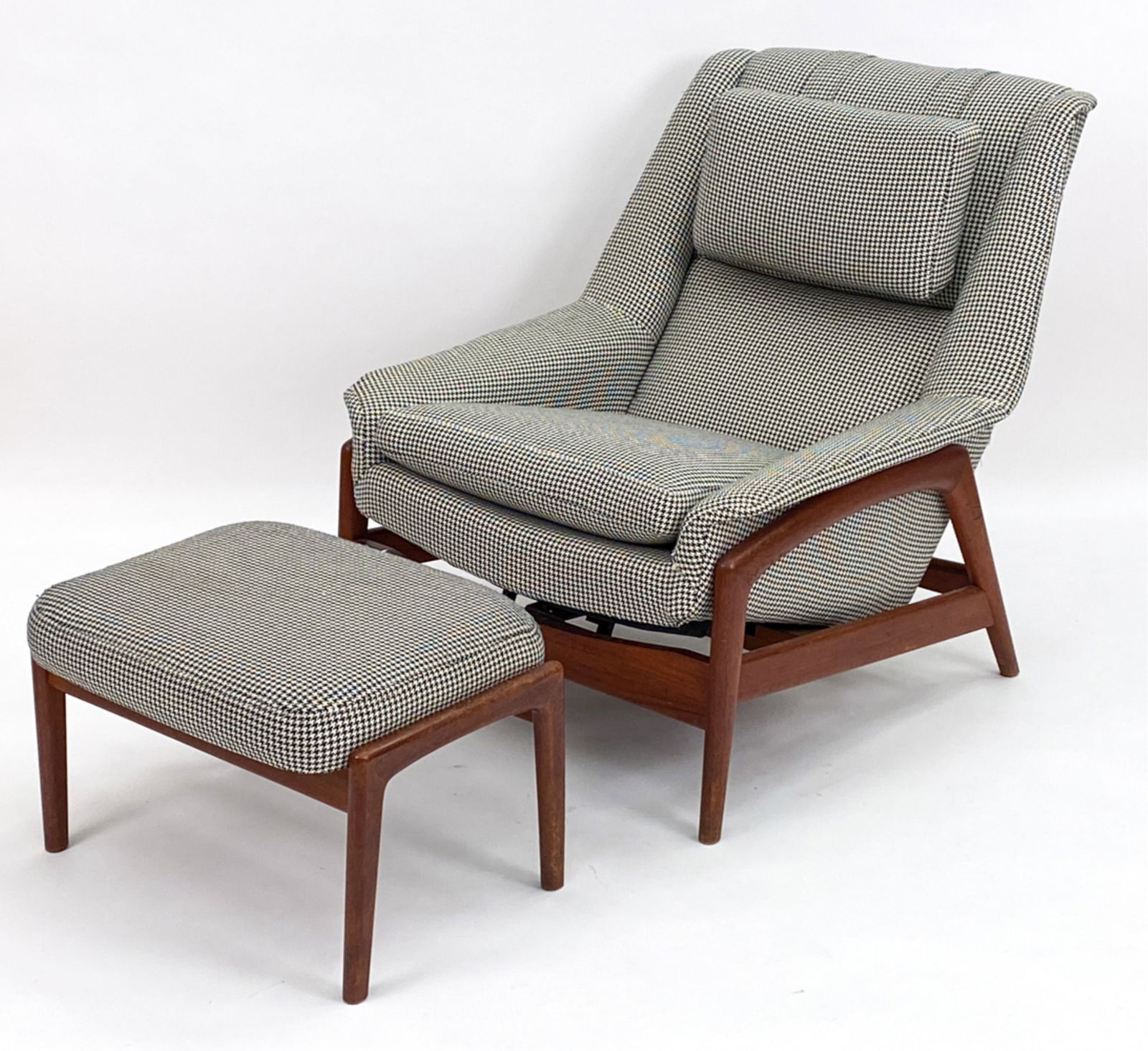 FOLKE OHLSSON DUX LOUNGE CHAIR & OTTOMAN: Folke Ohlsson for Dux of Sweden reclining lounge chair and adjustable ottoman, model Profil, designed in 1956. Teak wood frame. Upholstered, with matching removable headrest. Dimensions: (Chair) H 34.