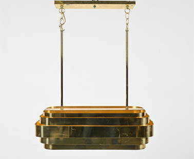 TIERED GOLD-PLATED METAL LINEAR CHANDELIER, 1970'S: In the manner of Jules Wabbes or Hans-Agne Jakobsson. Dimensions: H 31.5" x W 26" x D 11.5" Condition: Wiring not tested. Fixture presents beautifully overall. Light pitting, a few scuffs and scratche