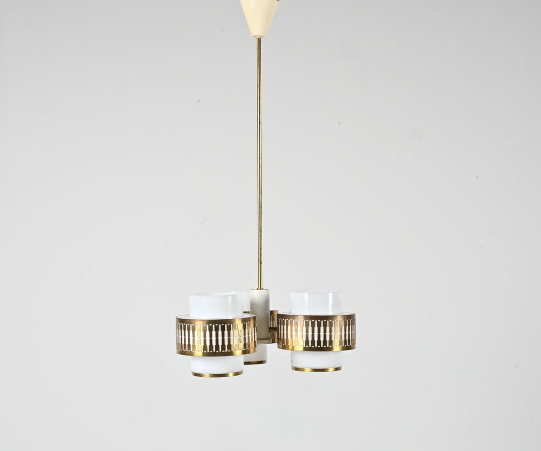 LYFA DANISH CHANDELIER IN WHITE ACRYLIC & BRASS: Rare Danish Mid-Century three-light chandelier in perspex or white acrylic and pierced brass. Labeled Lyfa near one socket, c. 1960's. Dimensions: (Overall) H 36.25" x Dia. 16.5" Condition: Wiring not