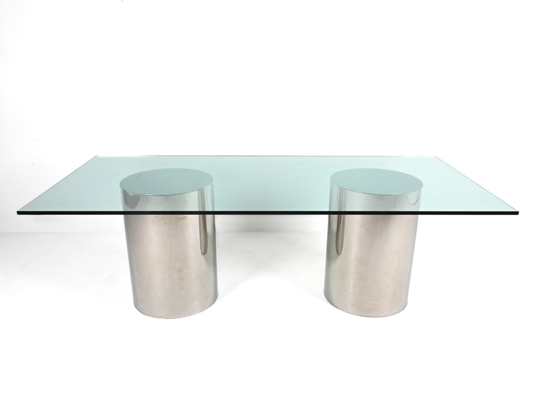 BRUETON "DT DRUM" CHROME & GLASS DINING TABLE: C. Late 20th Century; with original catalog spec sheet. Dimensions: H 29.25" x W 90" x D 42" Conditions: Minor scuffing to the base, two small chips to the glass.