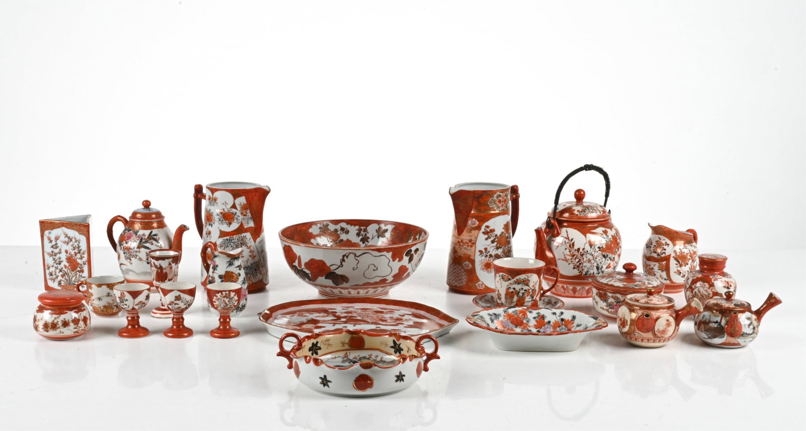 LARGE GROUPING OF JAPANESE KUTANI PORCELAIN: Dimensions: (Tallest) H 6.5" x W 6" x D 4.25" Condition: Natural crazing, a few minor nicks to a few of the porcelain.