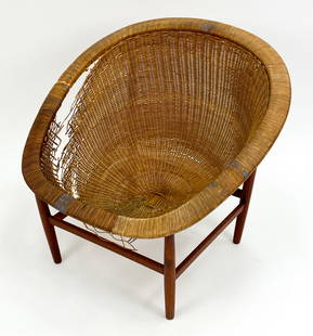 NANNA DITZEL DANISH MODERN TEAK BASKET CHAIR: Nanna Ditzel's iconic basket chair. Wicker with teak frame hand-crafted in Denmark. Designed circa 1950s. Ludvig Pontoppidan makers mark under. Dimensions: H 29.5" x W 32.25" x D 29.5" x SH 15" Condit