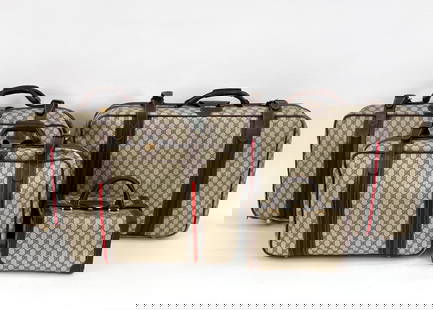 VINTAGE GUCCI GG SUPREME 4-PIECE LUGGAGE SET: Fabulous and rare (4) piece soft-sided luggage suite in iconic Gucci GG monogram coated canvas, with classic web stripes and brown leather trim. C. 1970's-1980's. Dimensions: (Largest) H 17" x W 28" x