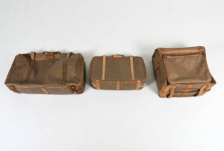 VINTAGE GUCCI COATED CANVAS LUGGAGE SUITE: (3) Soft-sided suitcases - including a wardrobe bag with hangers - featuring rare early GG diamond monogram-print coated canvas and tan leather trim. One original box included. Dimensions: (Largest su