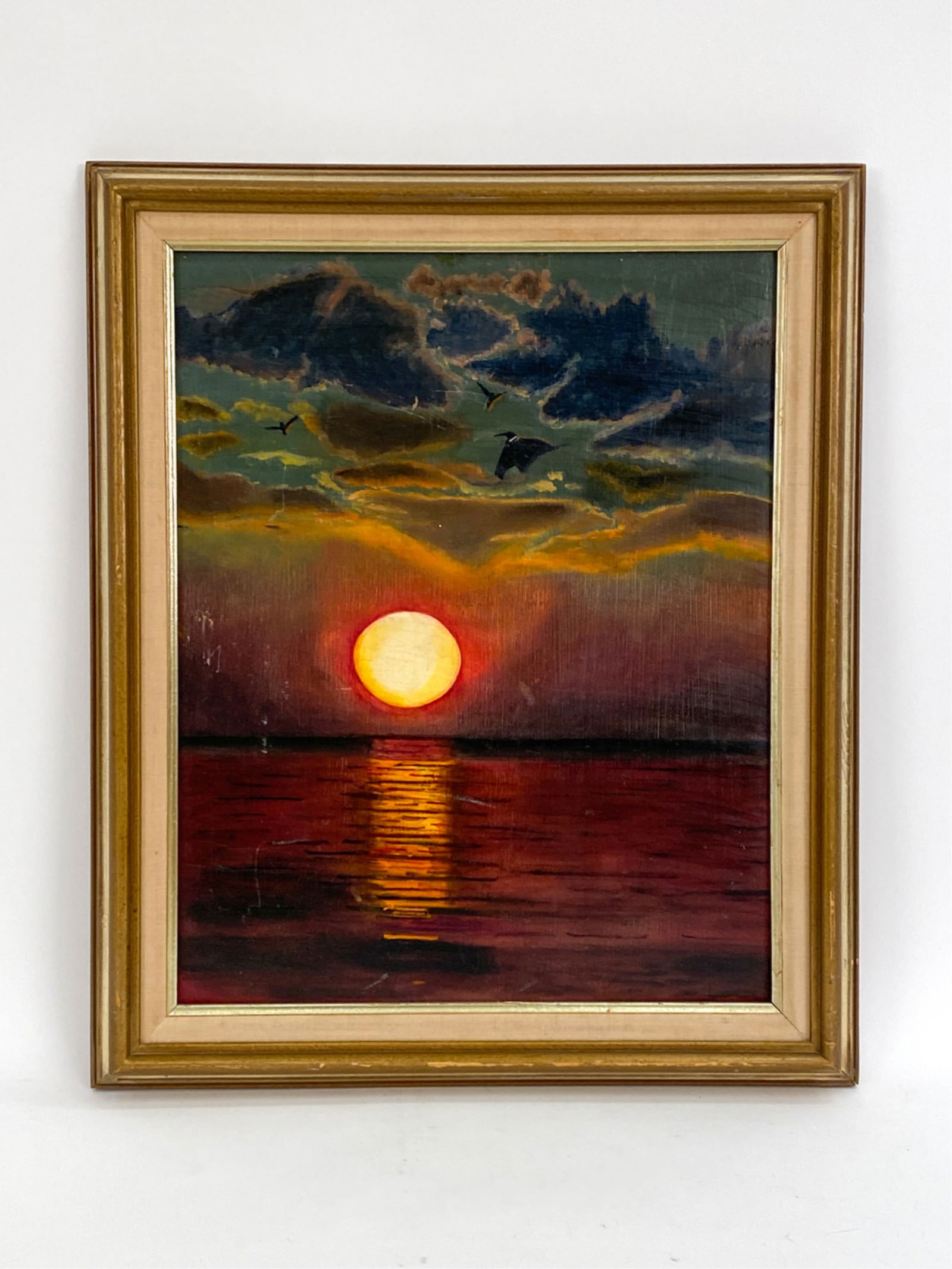 OIL ON MASONITE SUNSET VIEW: Sunset view over the water. Apparently unsigned. Dimensions: (Frame) H 24" x W 20.25", (Painting) H 20" x W 16" Condition: Uneven varnish, a few scratches throughout.
