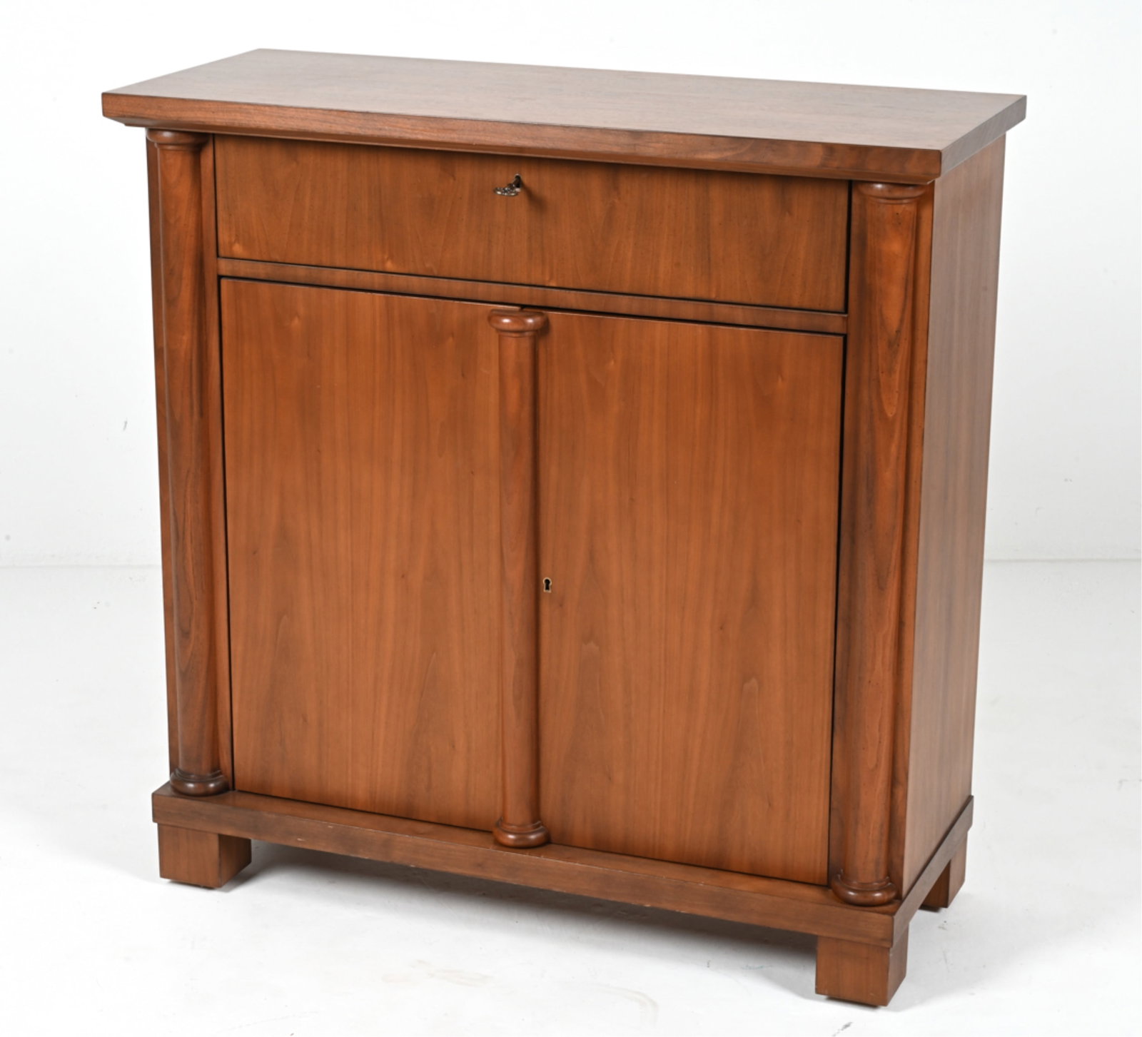 CONTEMPORARY EMPIRE-STYLE CABINET: Keys included. Dimensions: H 39.25" x W 38.75" x D 15.5" Condition: In very good used condition overall; a few minor scuffs and water spots to top; candle odor and a few spots of soiling to drawer.