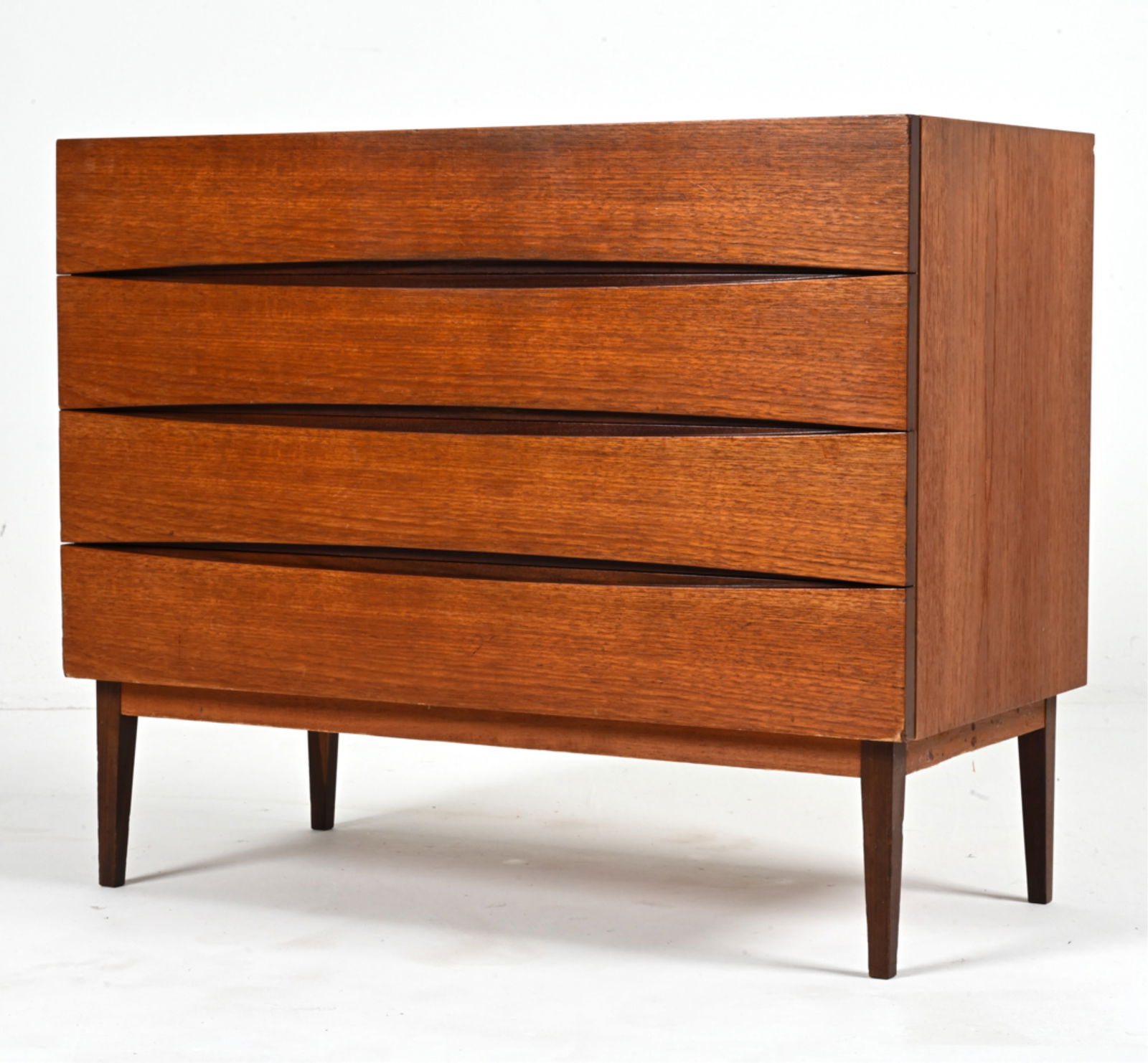 MANNER OF ARNE VODDER DANISH TEAK CHEST, C. 1960'S: Dimensions: H 27.5" x W 33.5" x D 16.5" Condition: Dents and scuffs to top; minor losses to the finish. Wear consistent with age and use. PC050