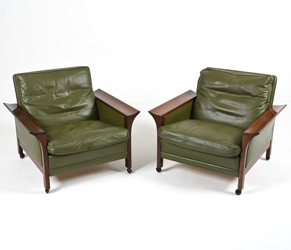 (2) ATTR. ARNE VODDER ROSEWOOD & LEATHER ARMCHAIRS: Fantastic pair of Danish Modern lounge chairs in solid rosewood and olive green leather, attributed to Arne Vodder, c. 1960's-1970's. On casters. Dimensions: H 27" x W 32.25" x D 31" x SH 14.5" Condit