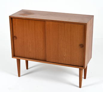 KAI KRISTIANSEN DANISH TEAK CREDENZA, 1960'S: Teak cabinet with sliding doors, designed by Kai Kristiansen for Feldballes Mobelfabrik, c. 1960's. Dimensions: H 30" x W 33.75" x D 12.5" Condition: Minor sun fading, a few water spots to top; a few