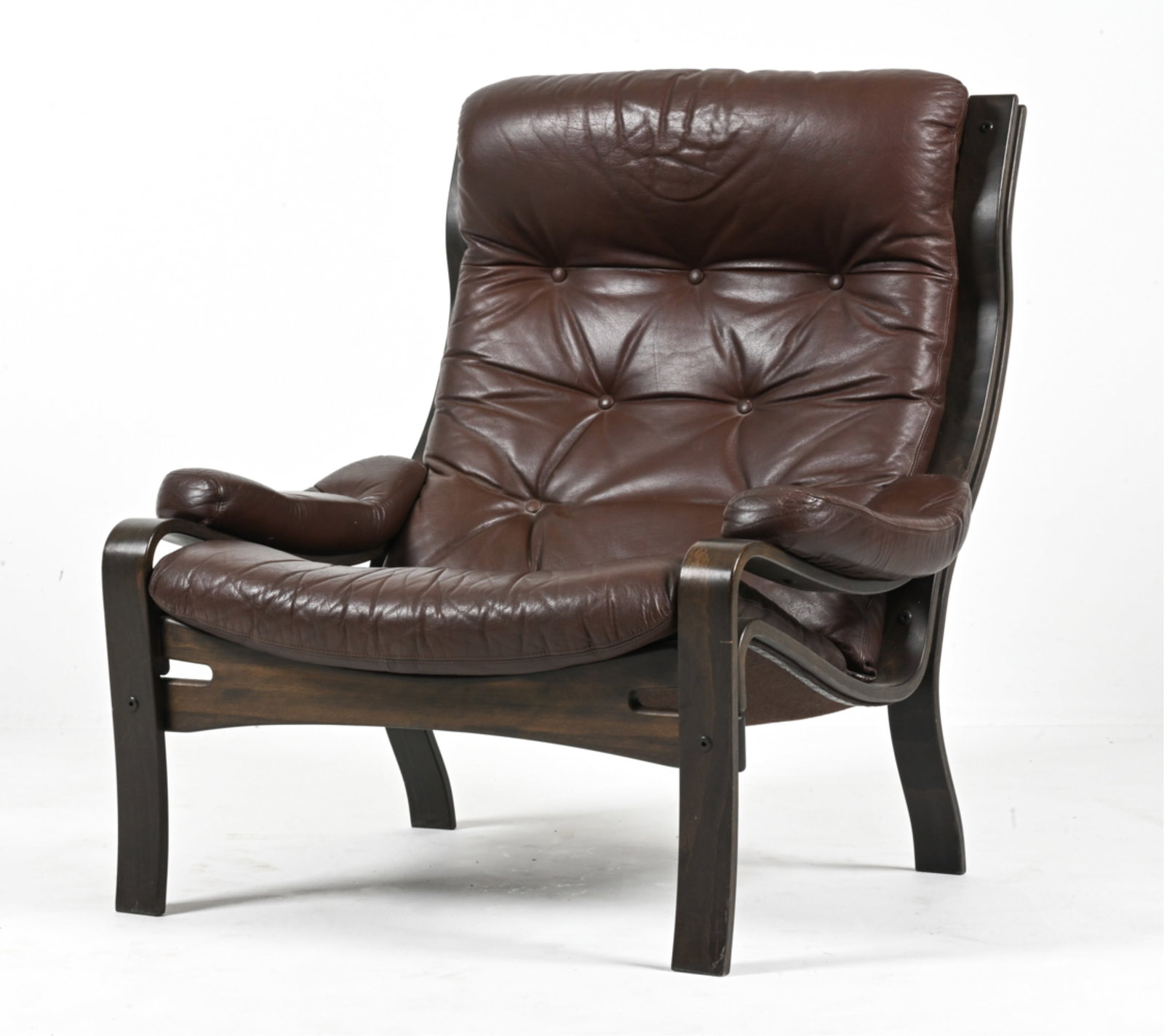 SCANDINAVIAN BENTWOOD & LEATHER LOUNGE CHAIR: Scandinavian Modern armchair in dark brown leather and bent laminated beech wood, finished in dark espresso stain. In the style of Bruno Mathsson; c. 1970's. Dimensions: H 37" x W 35" x D 32" x SH 17"