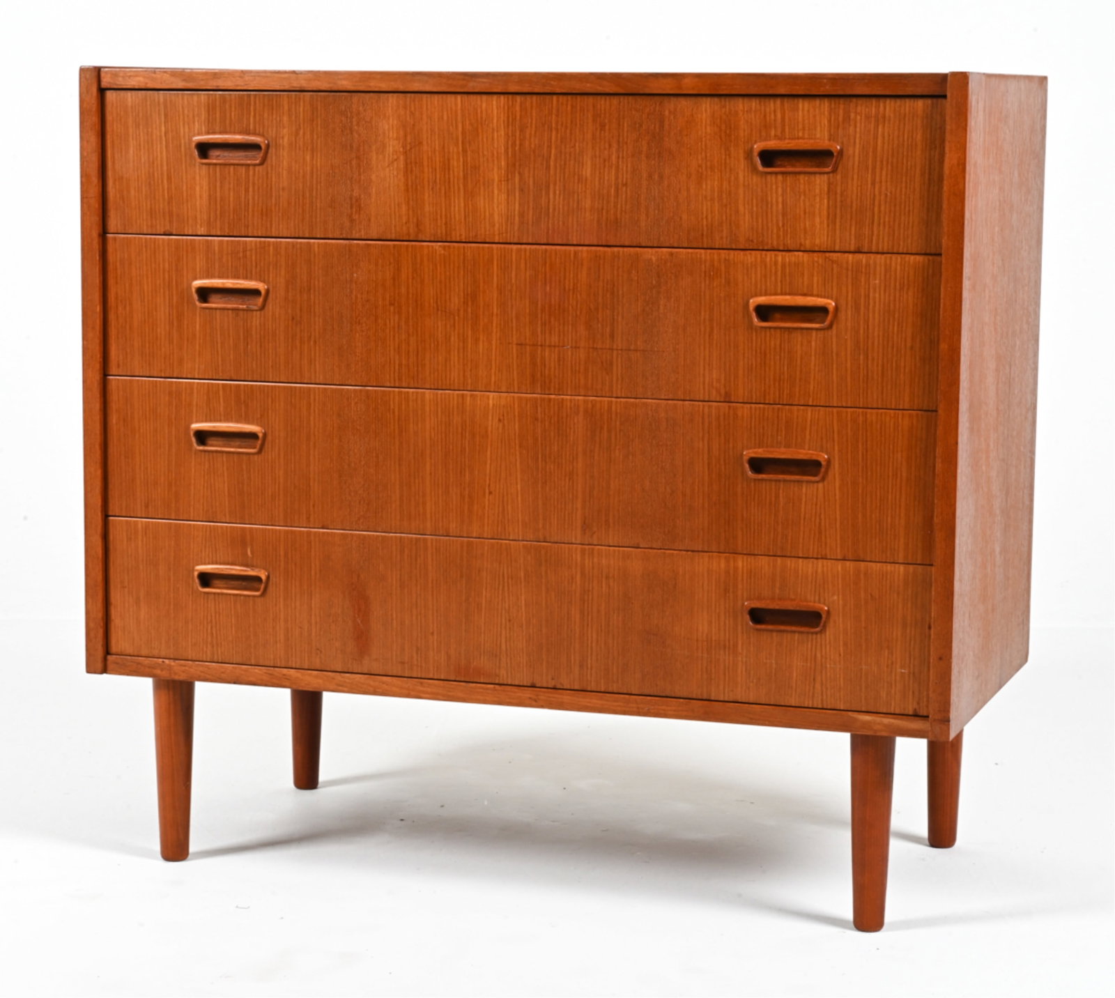 DANISH MID-CENTURY TEAK CHEST OF DRAWERS: Dimensions: H 32.5" x W 35.5" x D 17" Condition: In good vintage condition overall. Faint water ring to top; scattered dings and scuffs; a few shallow gouges to front. DMA142