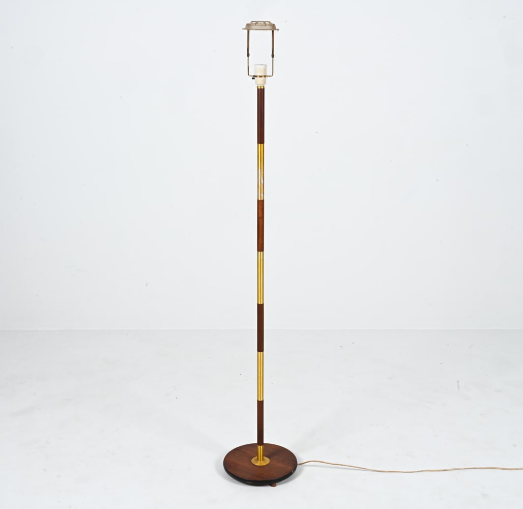 MID-CENTURY TEAK & GOLDTONE METAL FLOOR LAMP: Dimensions: H (to socket) 55.25" x Dia. 10.5" Condition: European plug; wiring not tested, will require rewiring or adapter for use in the U.S. Pitting and finish losses to metal; teak in good vintage