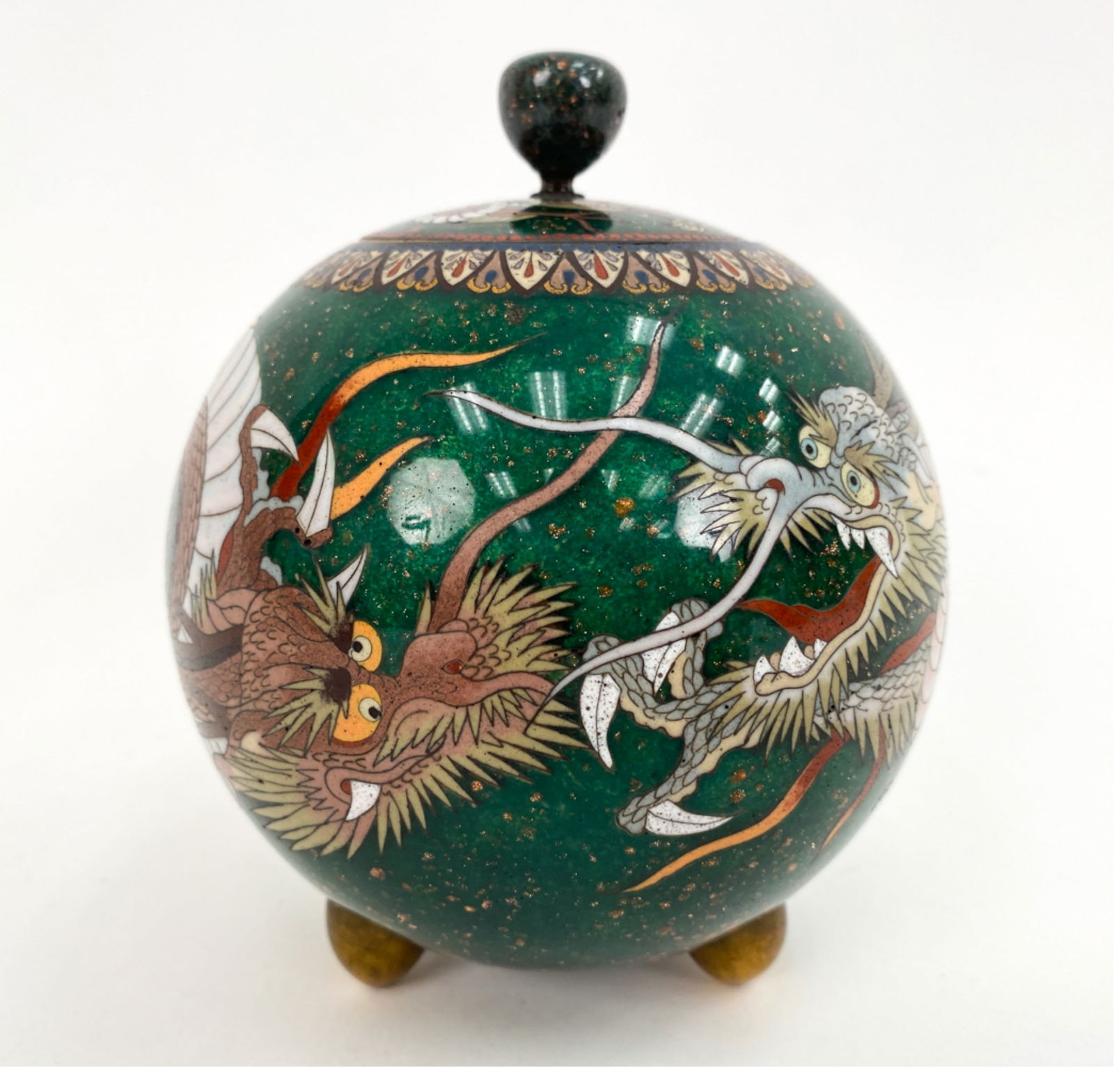 CLOISOINNE LIDDED VESSEL: Dragon design. Apparently unsigned. Conical feet. Dimensions: H 6" x Dia 5" Condition: Light handling marks.