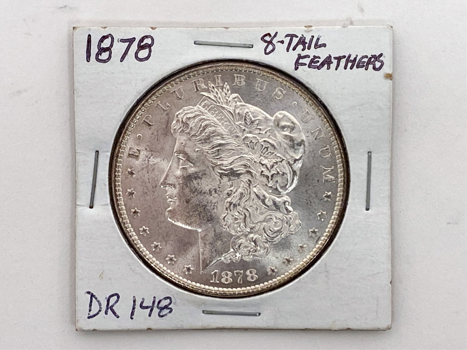 1878 SILVER DOLLAR: Marked on case, 8-tail feathers, DR 148, 509B5K. All coins are in the condition presented in the photos. Dimensions: L 2" x W 2"