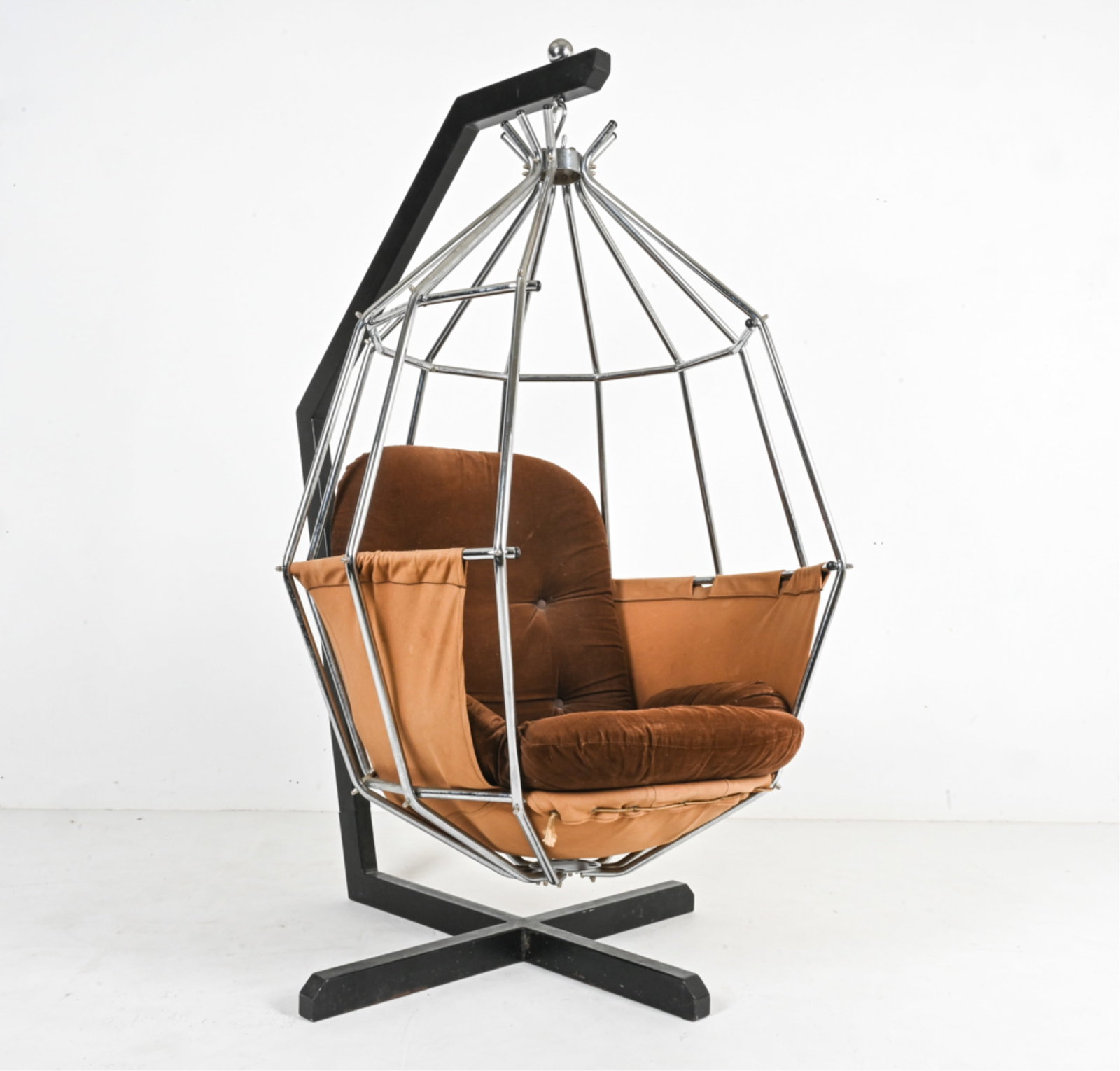 IB ARBERG HANGING "PARROT" CHAIR ON STAND, 1970'S: Swedish, c. 1970's. Dimensions: H 65" x W 35.5" x D 48.5" x S.H. 16" Condition: Great candidate for reupholstering; soiling and fading to fabric. A few scuffs and scratches to frames. R89