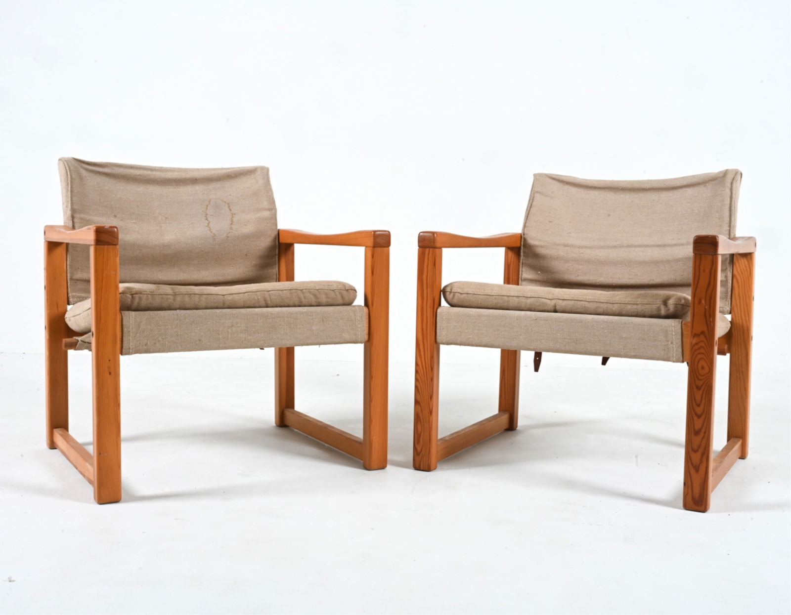 (2) KARIN MOBRING EARLY IKEA "DIANA" SAFARI CHAIRS: Beautiful pair of vintage Ikea safari-style chairs in pine, canvas and leather. Model "Diana", designed by Karin Mobring, c. 1970's. Dimensions: H 28" x W 24.75" x D 24" x SH 15.5" Condition: Frames w