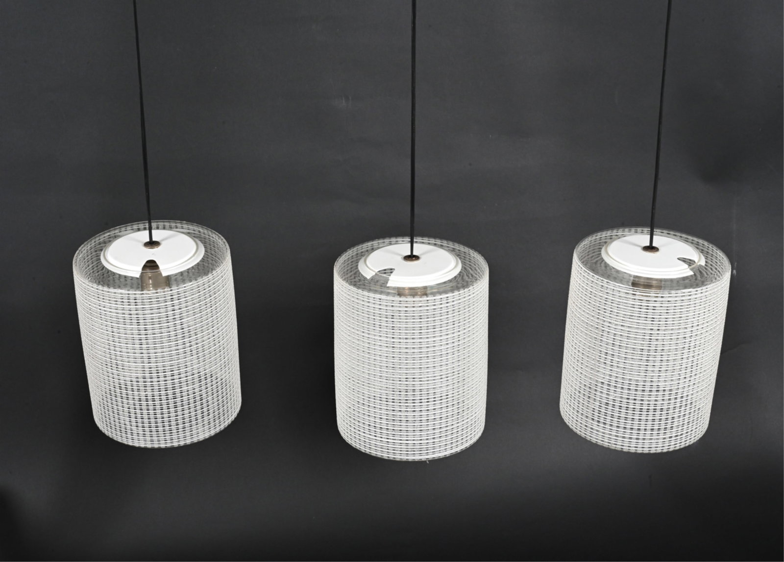 (3) RAAK DUTCH MODERN ETCHED GLASS PENDANT LIGHTS: Model B1174, c. 1960's-1970's. Dimensions: (Glass shade only) H 10" x Dia. 8.25" Condition: Wiring not tested. Glass edges are inherently slightly rough; a few additional tiny flea bites. No major chi