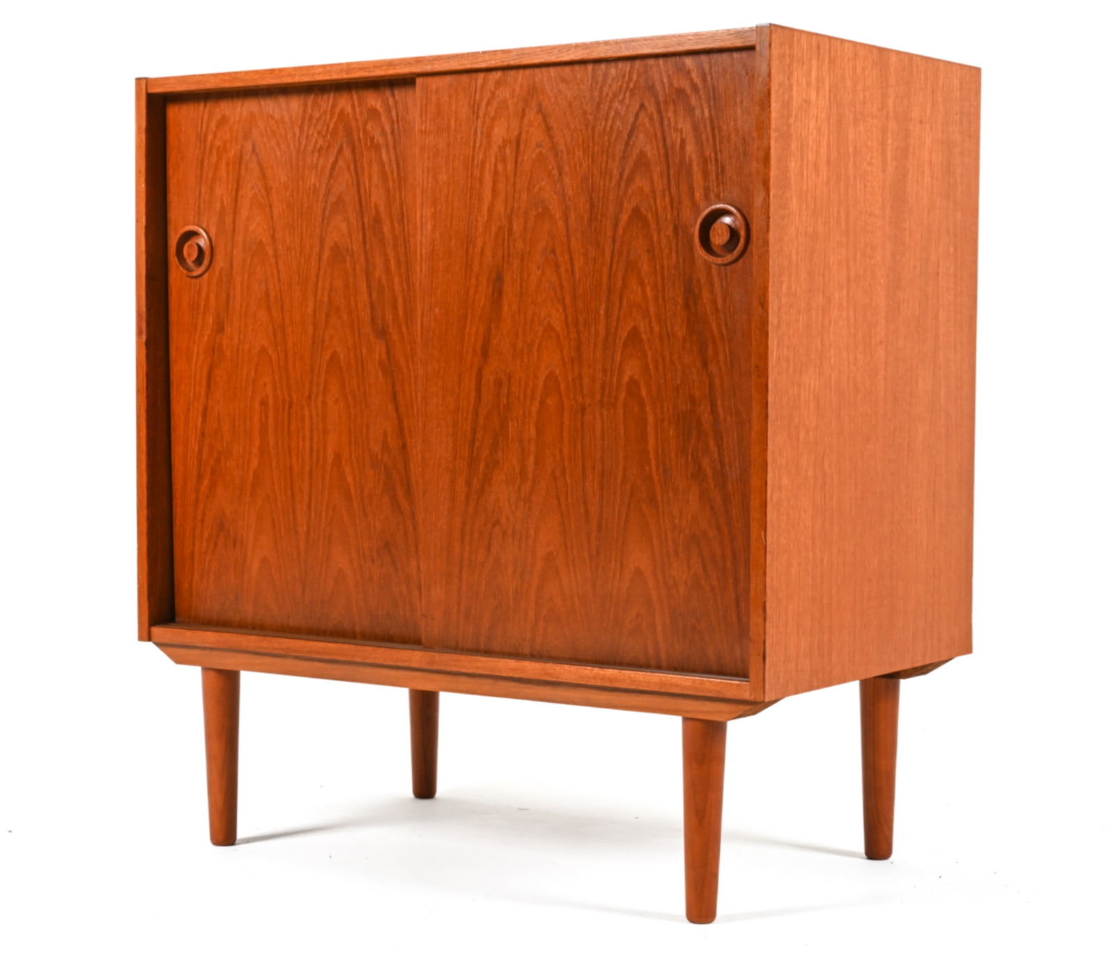 DANISH MID-CENTURY TEAK CABINET: Denmark c. 1960's-1970's. Dimension: H 33.25" x W 31.5" x D 17.25" Condition: Uneven sun fading; scattered scuffs and scratches. Surface wear consistent with age and use. 050