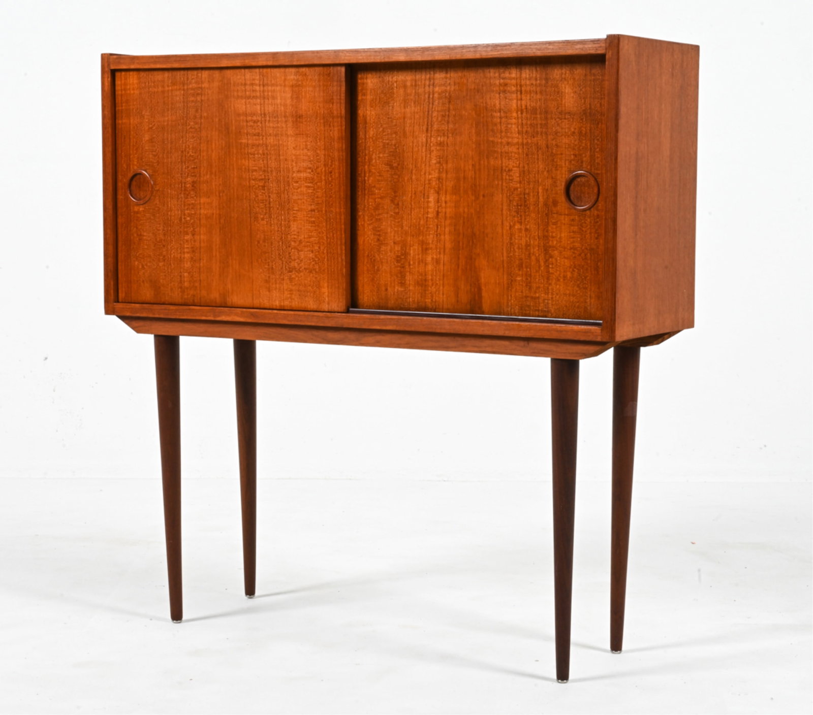 DANISH MID-CENTURY TEAK CABINET: Dimensions: H 30" x W 29.5" x 9.25" Condition: Wear consistent with age and use. Minor dings and scuffs overall. A few small losses to masonite back panel. 073
