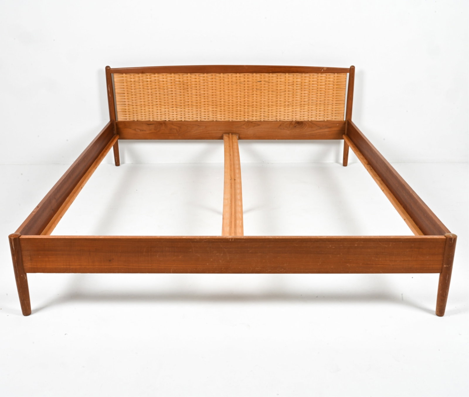 ATTR. KAI WINDING HUNDEVAD TEAK & RATTAN DAYBED: Attributed to Kai Winding for Poul Hundevad, Denmark, c. 1960's. Dimensions: (Exterior) H 29.5" x W 69" x D 81.5" ; (Interior) W 67" x D 79" Conditions: A few scattered scuffs and scratches, one small