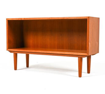 DANISH MID-CENTURY TEAK CONSOLE BOOKCASE: Dimensions: H 23.5" x W 39.25" x D 11.75" Condition: Light surface wear, including light scuffing and scratching to legs. Presents very well overall. DMC077