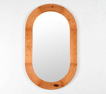 SWEDISH MODERN PINE OVAL MIRROR: Late 20th Century. Dimensions: H 39.25" x W 23.5" Condition: Scattered dings, scratches, and scuffs to wood. Surface wear consistent with age and use. J088