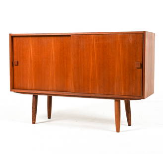 DOMINO MOBLER DANISH TEAK SIDEBOARD, C. 1970'S: Labeled on back panel. Dimensions: H 31.5" x W 48" x D 15.5" Condition: Sun fading; nicks and scuffs throughout; a few spots of soiling/water marks; a few small retouches to veneer. Wear consistent wi