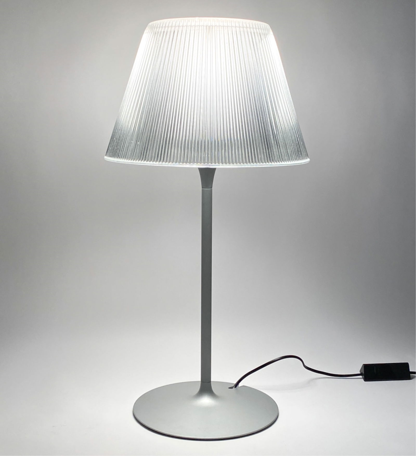 PHILIPPE STARCK FOR FLOS "ROMEO MOON" T1 LAMP: Model T1 "Romeo Moon" table lamp in glass and steel, designed by Philippe Starck for Flos, Italy. "Series Romeo Moon" label inside shade. Late 20th Century. Dimensions: H 26" x Dia. 13" Condition: Min