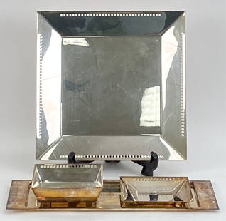 RICHARD MEIER SWID POWELL SILVERPLATE GROUP: (4) Pieces in total. Designed by Richard Meier for Swid Powell, c. 1980's. Signed underneath. Dimensions: (Longest tray) L 17.75" x W 7" Condition: Surface tarnish and handling wear.