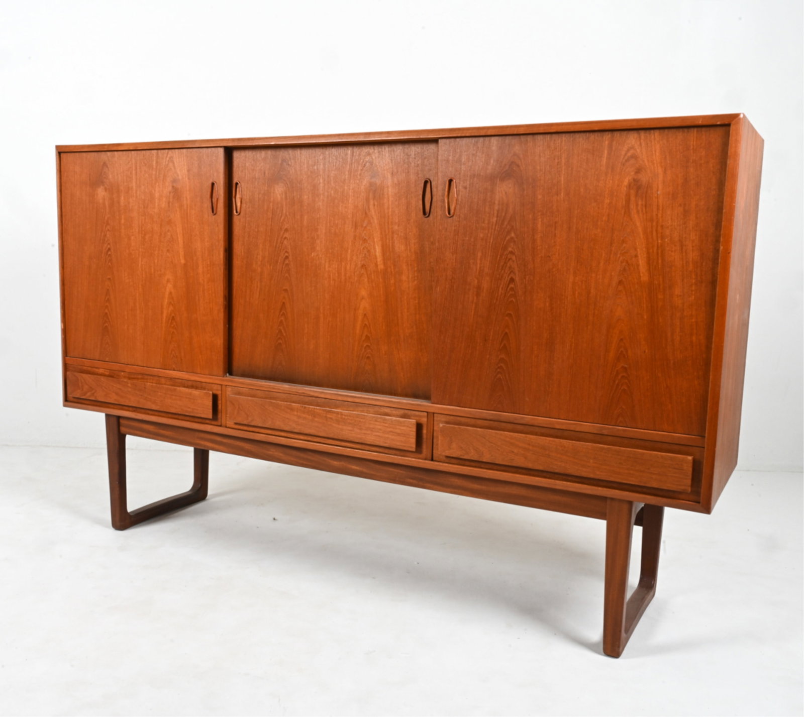 SCANDINAVIAN MID-CENTURY TEAK SIDEBOARD WITH BAR: c. 1960's-1970's. Dimensions: H 43.75" x W 71" x D 17.75" Condition: Minor fading; a few dings and scuffs. Wear consistent with age and use.