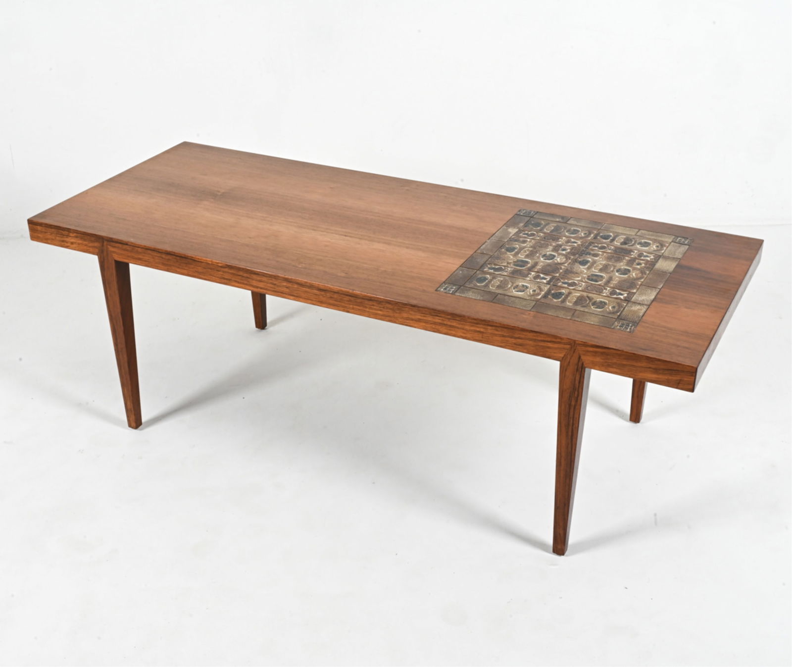 S. HANSEN ROSEWOOD COFFEE TABLE W/ THORSSON TILES: An exceptional Danish Mid-Century coffee table in rosewood, designed by Severin Hansen for Haslev Mobelsnedkeri; featuring an inset mosaic of ceramic tiles from the iconic "Baca" series designed by Ni