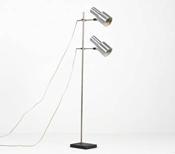 MODERN MINIMALIST DOUBLE-SPOTLIGHT FLOOR LAMP: With slate base. In the style of Peter Nelson. Europe, c. 1970's. Dimensions: (As shown) H 53" x W 16" x D 10.5" Condition: European plugs; wiring not tested, will require rewiring or adapter for use