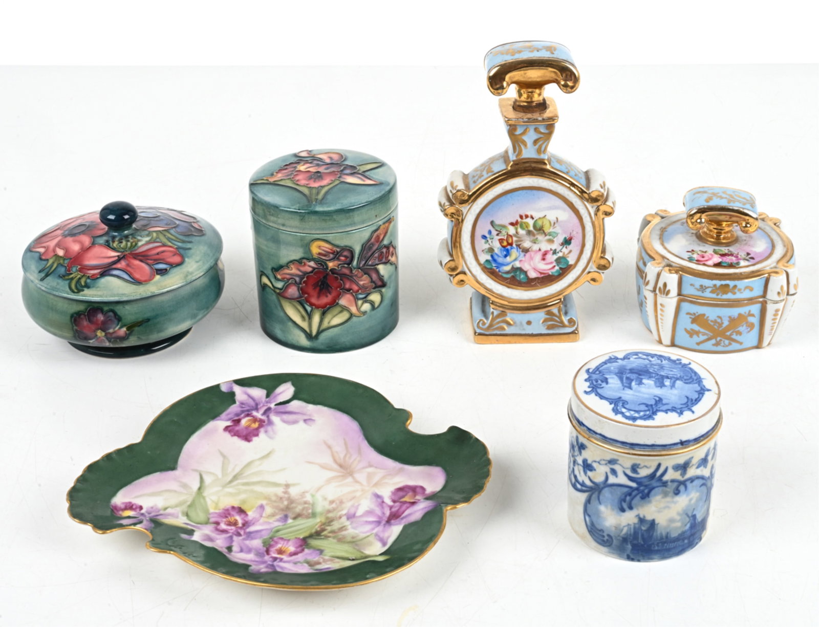 GROUPING OF ANTIQUE CERAMICS INCL. MOORCROFT: Grouping of antique table accessories and objets de toilette, including (2) Moorcroft jars, an Old Paris porcelain perfume bottle and box, and various others. Dimensions: (French perfume bottle) H 7"